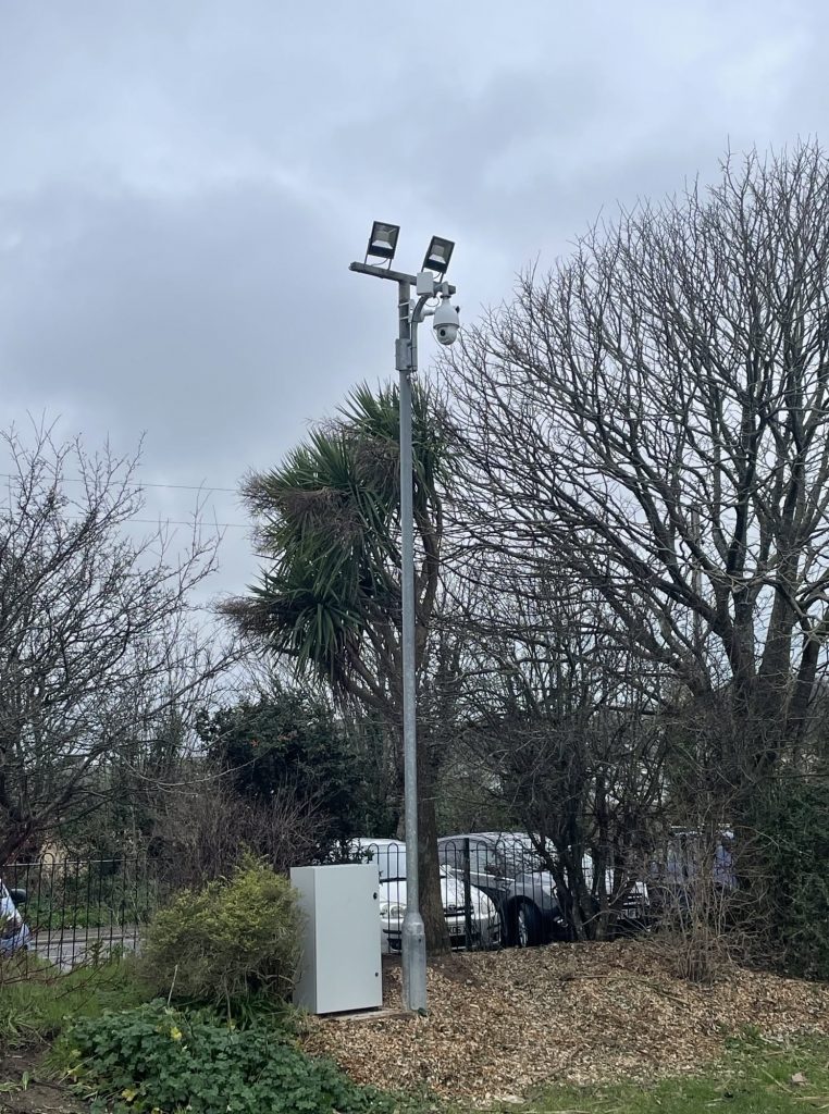 A photo of two CCTV cameras on a tall pole overlooking Hayle Recreation Ground